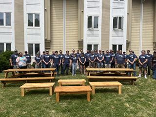 Crescent employees making a bench and picnic table