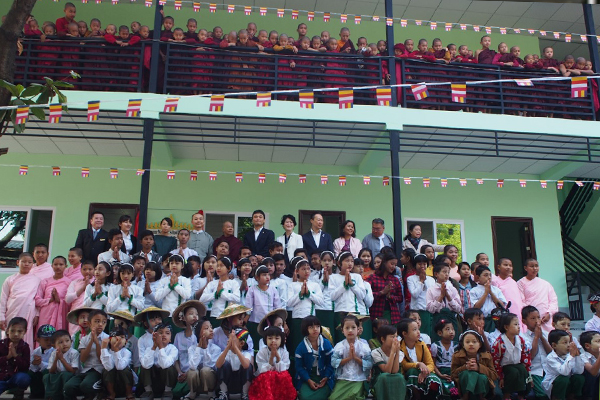 Monastic School After Rebuilding and Attendees at the Ceremony