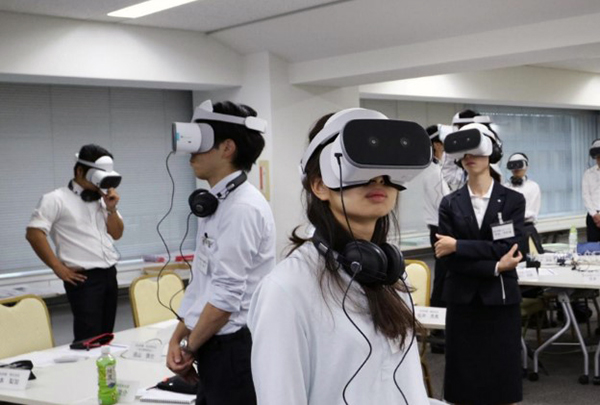 Visual and auditory sensory training via video projected to a head-mounted display worn by trainees